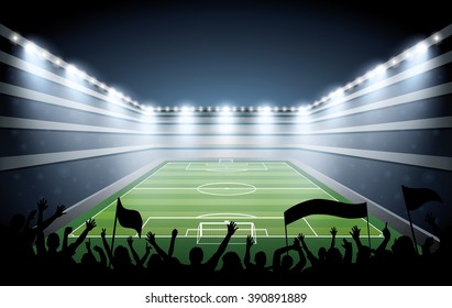 Excited crowd of people at a soccer stadium.

