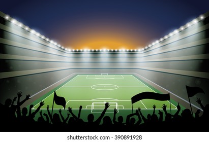Excited crowd of people at a soccer stadium.
