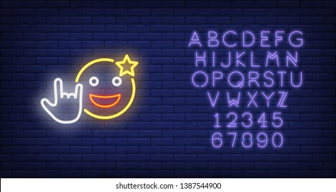 Excited emoticon with cool gesture neon sign. Star on smiley, showing rock symbol. Night bright advertisement. Vector illustration in neon style for rock concert and spectacular