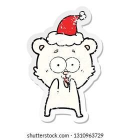 historieta de un emocionado oso de peluche dibujado a mano pegatina angustiada de un sombrero de santa