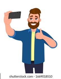 Excited young hipster man taking selfie with phone and making thumbs up gesture sign. Happy trendy person holding smartphone and capturing photograph. Modern technology illustration in vector cartoon.