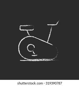 Exercise bike hand drawn in chalk on a blackboard vector white icon isolated on a black background.