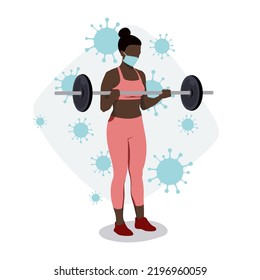 Exercises with a face mask. Woman training with barbell in gym wearing medical mask to protect against virus. Sport during coronavirus pandemic concept.