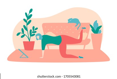 Exercising at home. Young woman doing leg press exercise at her apartment. Online fitness for women. Working out during self-isolation and quarantine period.