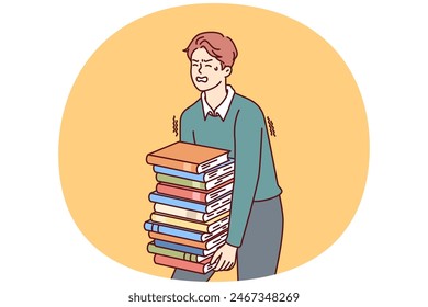 Exhausted man carries large stack of books suffering from overload while preparing for exams. Guy student who wants to go to college or university takes books and literature from library