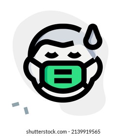 exhausted man getting sweat while wearing the face mask