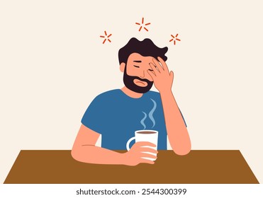 Exhausted young man sit at table drink coffee feel fatigue or drowsiness. Tired guy suffer from overwork lack energy need caffeine. Overwhelmed with work.