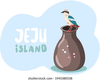 Exotic bird sits on clay jug and Jeju island inscription in blue. National pitta nymfa on pottery