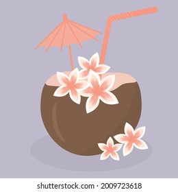 Exotic coconut cocktail with tropical flowers.