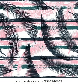 Exotic coconut palm leaves tree branches over painted stripes seamless pattern design. Madagascar jungle foliage beach fashion fabric print. Tropical leaves silhouettes wallpaper.