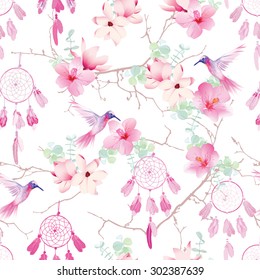 Exotic dream catchers on the branches seamless vector pattern. Delicate print with tropical flowers and hummingbirds.
