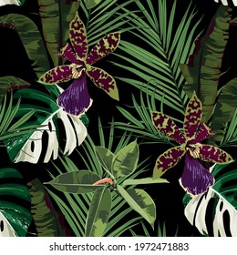 Exotic flowers seamless pattern. Tropical violet green orchid flowers and palm leaves in summer print. Hawaiian t-shirt and swimwear tile. Black background.