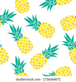 Exotic fruits on a white background. Seamless background with pineapples. Yellow pineapples.