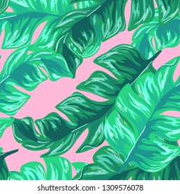 Exotic leaves on a green background. Tropical pattern with banana leaves.