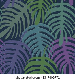 Exotic Monstera liana leaf silhouette hand-drawn in green, purple and beige colors seamless pattern on dark blue background.