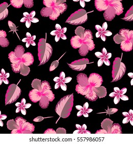 Exotic multicolor flowers in allover composition. Multicolor pattern for summer fashion, interior, wallpaper. Seamless vector tropical design with hibiscus, leaves and buds on a black background.