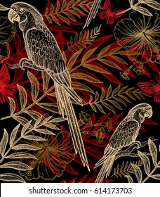 Exotic plants and birds parrots. Vector seamless floral pattern. Hand drawing of wildlife. Illustration - template for luxury fabric, paper. Gold and red branch, leaves, flowers on black background.