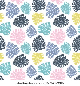 Exotic seamless colorful bright pattern with colorful tropical jungle leaves silhouettes on white background. Floral modern pattern for textile, manufacturing etc. Vector illustration