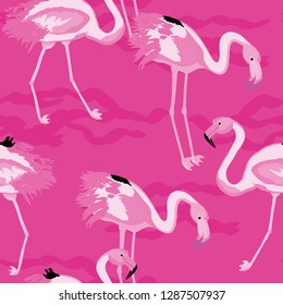 Exotic seamless pattern with pink flamingos. Summer background with birds. Flamingo.