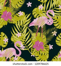 Exotic seamless pattern with pink flamingos,tropical leaves and hibiscus. Summer background with plants and birds.