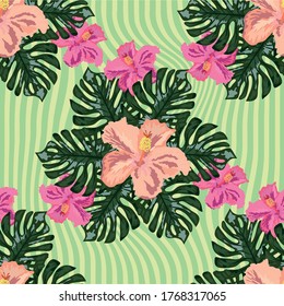 Exotic seamless pattern with tropical leaves and flowers on a black background. Striped background. botanical print.