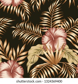 Exotic trendy seamless composition from tropical flowers hibiscus and palm, banana leaves gold tint on the black background