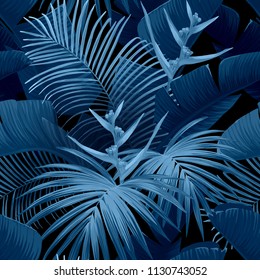Exotic tropical background with hawaiian plants and flowers. Seamless vector indigo pattern with banana and royal palm leaves, bird of paradise flowers. Vector illustration.