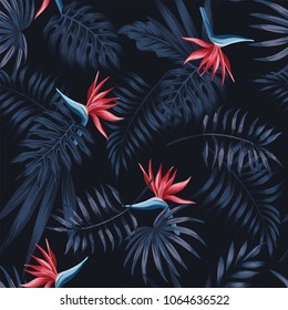 Exotic tropical flowers bird of paradise (strelitzia) red color blue palm leaves dark night jungle background seamless vector pattern beach illustration