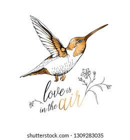 Exotic Tropical hummingbird and flowers. Gold and silver composition. Love is in the air - lettering quote. Card design, hand drawn style t-shirt print. Vector illustration.