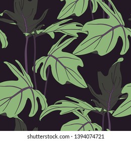 Exotic tropical leaves, black background. Floral seamless pattern.
