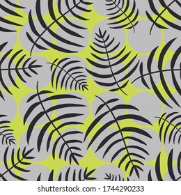 Exotic tropical palm leaves on abstract green background with gray circles. Vector seamless pattern.