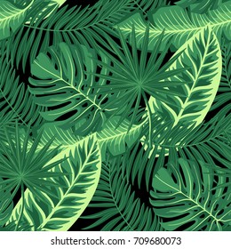Exotic tropical seamless pattern with green plants and leaves. Vector monstera, palm leaves, floral background.