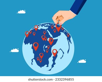 Expand business around the world. Businessman pinning branches on global map