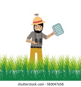 Expeditionary between the grass with his binoculars and book of notes, on his hat a bird