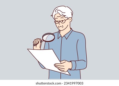 Experienced businessman is checking legal contract using magnifying glass to read fine print. Elderly man holds document and carefully studies all clauses of contract before signing or sealing