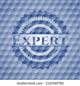 Expert blue emblem with geometric pattern background.