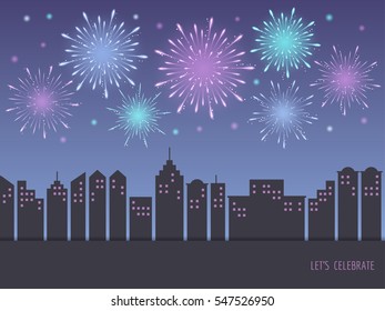 Exploding colorful fireworks display on night sky over cityscape, buildings. Fireworks for carnival, celebration, anniversary, new year and holiday party background.