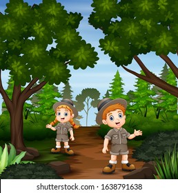 The explorer boy and girl at the forest