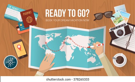 Explorer planning a trip around the world, he is tracing the route on the map, travel and adventure concept