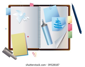exposed notebook with the paper figurine of cherub