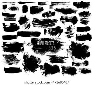 Expressive ink spots of black color on white background. Different brush strokes and shapeless scribbles. Isolated decorative elements for banners.