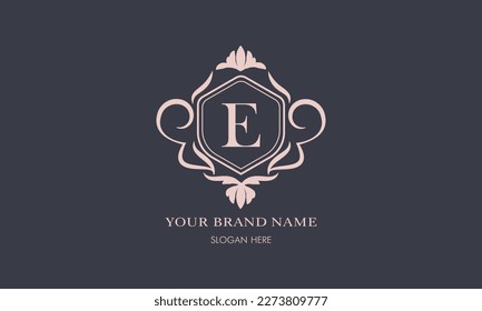 Exquisite baroque pattern. Floral ornament with initial letter E. Vintage frame, greeting card, wedding invitation. Vector logo template, label, business sign.