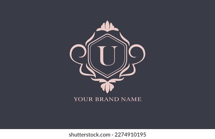 Exquisite baroque pattern. Floral ornament with initial letter U. Vintage frame, greeting card, wedding invitation. Vector logo template, label, business sign.