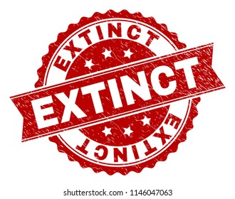 EXTINCT seal print with distress texture. Rubber seal imitation has round medallion form and contains ribbon. Red vector rubber print of EXTINCT caption with retro texture.