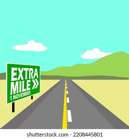 An "Extra Mile" sign on the side of the road with a view of the mountains in a cloudy blue sky to celebrate Extra Mile Day on November 1