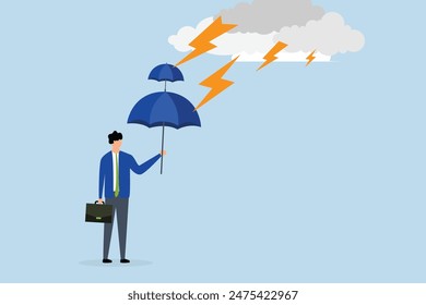 Extra protection for thunderstorm ahead, businessman holds a double layer umbrella to protect against the storm.