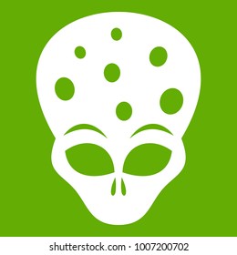 Extraterrestrial alien head icon white isolated on green background. Vector illustration