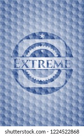 Extreme blue emblem or badge with abstract geometric pattern background.