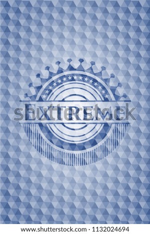Extreme blue emblem with geometric pattern.
