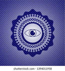 eye icon inside badge with denim background